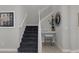 This staircase showcases a built-in desk area with neutral walls and carpeted stairs at 17026 Shell Bay Dr, Land O Lakes, FL 34638