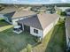 Aerial view of private backyard with screened patio and well-manicured lawn shows outdoor living space at 18629 Coastal Shore Ter, Land O Lakes, FL 34638