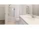 Bright bathroom with shower-tub combo, modern vanity, and neutral color palette offers a clean, relaxing space at 18629 Coastal Shore Ter, Land O Lakes, FL 34638
