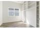 Bedroom with a large window and built-in shelving provides ample storage and a light-filled ambiance at 18629 Coastal Shore Ter, Land O Lakes, FL 34638