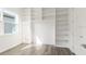 Bedroom with a large window and built-in shelving provides ample storage and a light-filled ambiance at 18629 Coastal Shore Ter, Land O Lakes, FL 34638
