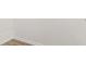 Showing corner of closet with white trim and wood-style flooring at 18629 Coastal Shore Ter, Land O Lakes, FL 34638