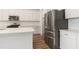 Modern kitchen with stainless steel appliances, white cabinets, and a center island at 18629 Coastal Shore Ter, Land O Lakes, FL 34638