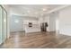 Bright, open-concept kitchen featuring stainless steel appliances, an island, and hardwood floors at 18629 Coastal Shore Ter, Land O Lakes, FL 34638