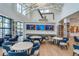 Inviting resident lounge featuring comfortable seating, multiple TVs, and stylish decor with wood accents at 18629 Coastal Shore Ter, Land O Lakes, FL 34638
