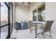 Cozy screened patio with outdoor kitchenette and seating is ideal for relaxation and casual dining at 18629 Coastal Shore Ter, Land O Lakes, FL 34638
