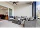 Relaxing screened patio with comfortable seating and ceiling fan for year-round enjoyment at 18629 Coastal Shore Ter, Land O Lakes, FL 34638