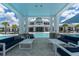 Relaxing poolside lounge area with comfortable seating and clear views of the pool and clubhouse at 18629 Coastal Shore Ter, Land O Lakes, FL 34638