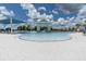 Beautiful pool and recreation area featuring shallow beach entry and shaded pavilion at 18629 Coastal Shore Ter, Land O Lakes, FL 34638
