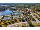 Southern Hills community aerial showcases tennis courts, pool, lake, and lush landscaping at 19504 Lily Pond Ct, Brooksville, FL 34601