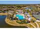 Aerial shot of Southern Hills community amenities, including a pool, clubhouse, and lake access at 19504 Lily Pond Ct, Brooksville, FL 34601