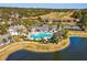 Aerial view of Southern Hills community pool, tennis courts, and scenic golf course at 19504 Lily Pond Ct, Brooksville, FL 34601