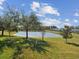 Peaceful backyard view overlooking a serene lake, perfect for relaxation and enjoying nature at 19504 Lily Pond Ct, Brooksville, FL 34601