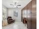 Cozy flex room featuring built-in storage, a comfortable chair, and natural light at 19504 Lily Pond Ct, Brooksville, FL 34601