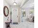 Bright and welcoming foyer with neutral tones and decorative accents, leading to the rest of the home at 19504 Lily Pond Ct, Brooksville, FL 34601