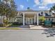 Community information center featuring classic architecture, prominent entrance, and welcoming landscaping at 19504 Lily Pond Ct, Brooksville, FL 34601
