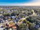 Picturesque aerial shot of a tranquil neighborhood surrounded by lush greenery and winding roads at 5518 Pinehurst Dr, Spring Hill, FL 34606