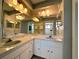 Bright bathroom features double sink vanity with ample storage, and updated fixtures at 5518 Pinehurst Dr, Spring Hill, FL 34606