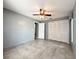 This bedroom is a canvas for personalization, featuring neutral walls and ceiling fan at 5518 Pinehurst Dr, Spring Hill, FL 34606