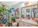 Cheerful bathroom featuring tropical-themed shower curtain and decor at 6002 Laketree Ln # L, Temple Terrace, FL 33617