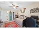 Comfortable bedroom featuring daybed, desk, and unique decorations at 6002 Laketree Ln # L, Temple Terrace, FL 33617