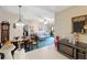 Open-concept living area with dining space and comfortable seating at 6002 Laketree Ln # L, Temple Terrace, FL 33617