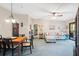 Bright living and dining area featuring comfortable sofa and modern furnishings at 6002 Laketree Ln # L, Temple Terrace, FL 33617