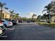 Well-maintained parking lot with ample parking spaces in a landscaped community at 6734 Dali Ave # 205, Land O Lakes, FL 34637