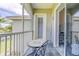 Cozy screened lanai with table and chairs overlooking a serene outdoor space at 6734 Dali Ave # 205, Land O Lakes, FL 34637