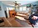 Inviting living room showcasing a comfortable sofa, wooden desk, and decorative accents at 7090 Red Oak Loop, New Port Richey, FL 34654