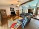 Cozy living room with plush sofas and wood flooring at 7090 Red Oak Loop, New Port Richey, FL 34654