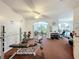 Bright gym featuring weight training equipment, machines, a ceiling fan, and light-colored walls at 8447 Pavilion Dr, Hudson, FL 34667