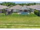 Spacious backyard with a pool, and a beautiful screened-in lanai at 9819 Bridgeton Dr, Tampa, FL 33626