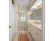 Bathroom with a glass-enclosed shower, vanity with double sinks, and tile flooring at 9819 Bridgeton Dr, Tampa, FL 33626