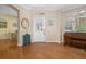 Elegant foyer featuring gleaming hardwood floors, natural light, and classic decor at 9819 Bridgeton Dr, Tampa, FL 33626