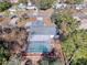 Bird's eye view of home highlighting the screened-in pool and mature landscaping at 12242 Greenwood St, Brooksville, FL 34613