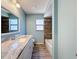 Inviting bathroom with granite counters, a sink and window creating a refreshing space at 12242 Greenwood St, Brooksville, FL 34613