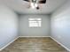 Vacant bedroom showcasing the flooring and natural light from the window at 12242 Greenwood St, Brooksville, FL 34613