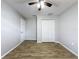 An empty bedroom with wood-look flooring and ceiling fan at 12242 Greenwood St, Brooksville, FL 34613