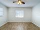 Bedroom featuring wood-look tile flooring, a ceiling fan, and one window with neutral paint at 12242 Greenwood St, Brooksville, FL 34613