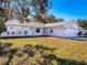 Beautiful home features an attached two-car garage and manicured landscaping at 12242 Greenwood St, Brooksville, FL 34613