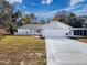 Charming single-story home features an attached two-car garage and long driveway at 12242 Greenwood St, Brooksville, FL 34613