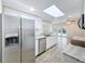Kitchen with stainless steel appliances, granite counters, and a view of the pool at 12242 Greenwood St, Brooksville, FL 34613