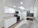 Beautifully updated kitchen featuring stainless steel appliances, granite counters, and a bright, modern skylight at 12242 Greenwood St, Brooksville, FL 34613