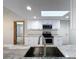 Bright kitchen featuring a stainless steel sink, white cabinets, and modern appliances at 12242 Greenwood St, Brooksville, FL 34613