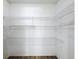 Walk-in pantry with wire shelving and wood flooring at 12242 Greenwood St, Brooksville, FL 34613