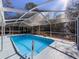 A stunning enclosed pool with glistening waters, providing a serene and private outdoor retreat at 12242 Greenwood St, Brooksville, FL 34613