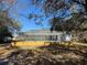Enclosed pool area with screen, enhanced with a raised wooden deck, providing a private oasis at 12242 Greenwood St, Brooksville, FL 34613