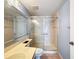 Bright bathroom featuring a walk-in shower with glass doors at 13103 Cypress Hill Dr # B2, Hudson, FL 34669