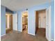 View of the bedroom with two doors: one to a bathroom and another to a walk-in closet at 13103 Cypress Hill Dr # B2, Hudson, FL 34669